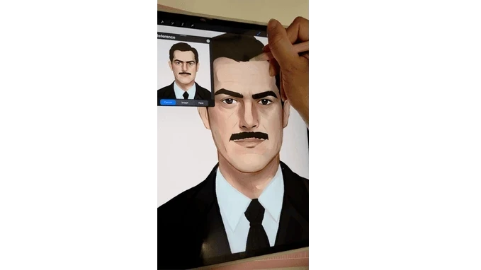 An artist working on a male character portrait on a tablet